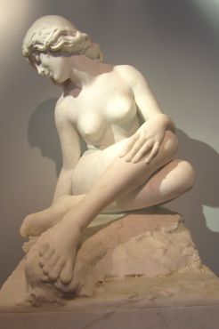 An exquisite marble carving of a Nymph at a well
